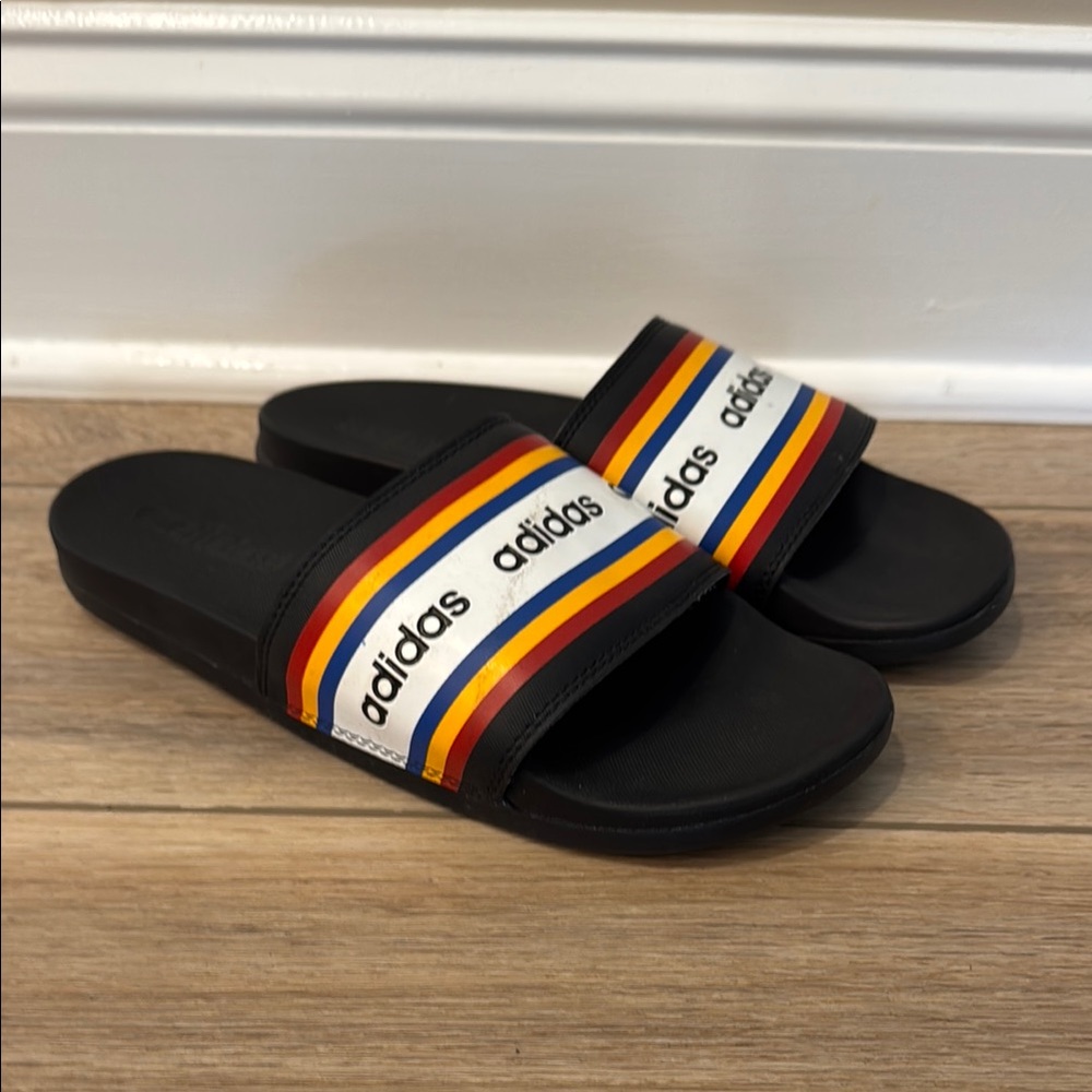 Adidas Black Slides with Red, Yellow, and Blue Stripes